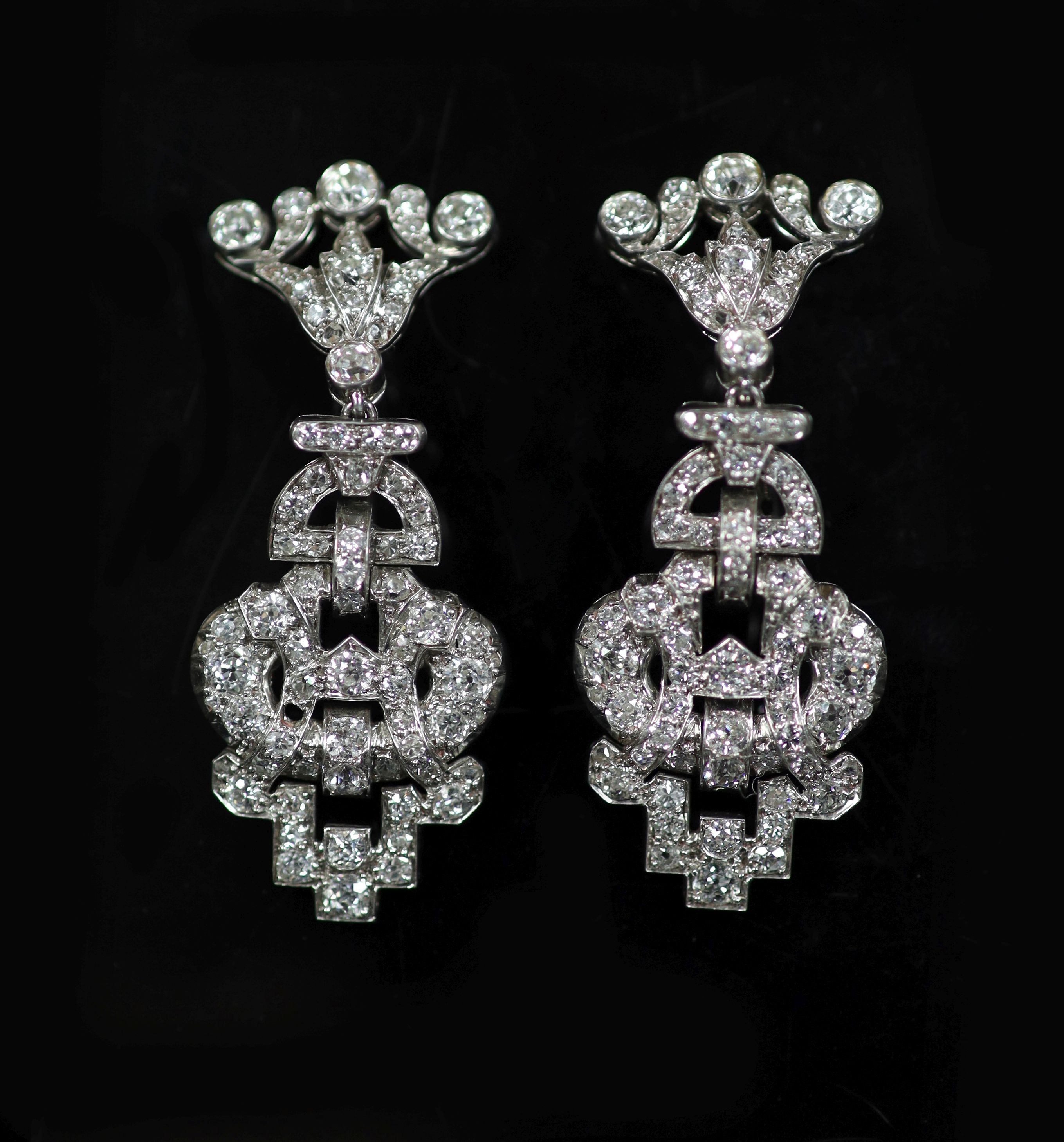 A cased pair of Victorian pierced platinum and old round cut diamond cluster set drop earrings